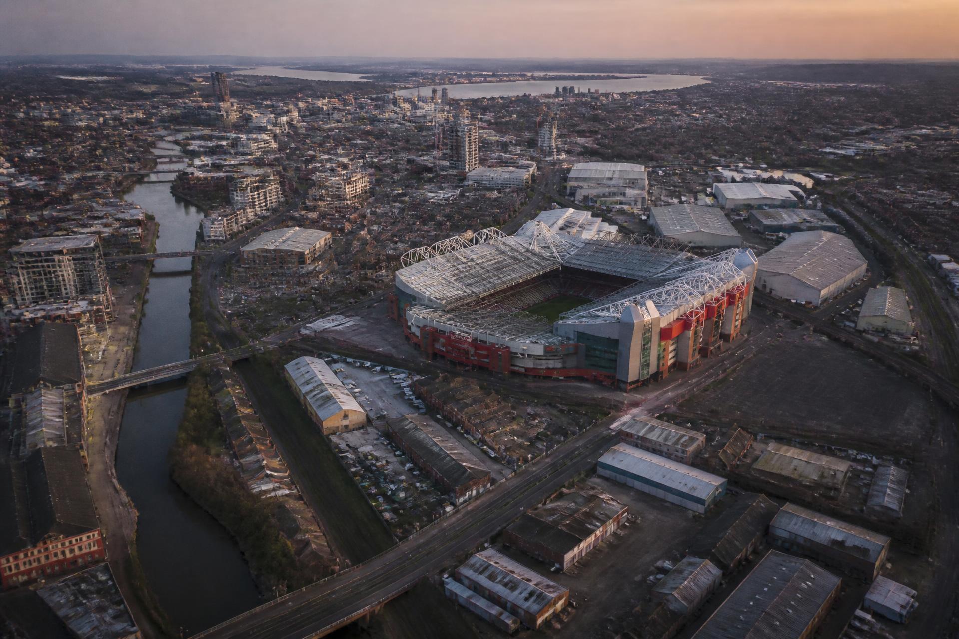 Aerial view of the existing Old Trafford stadium and the surrounding proposed regeneration area at dusk